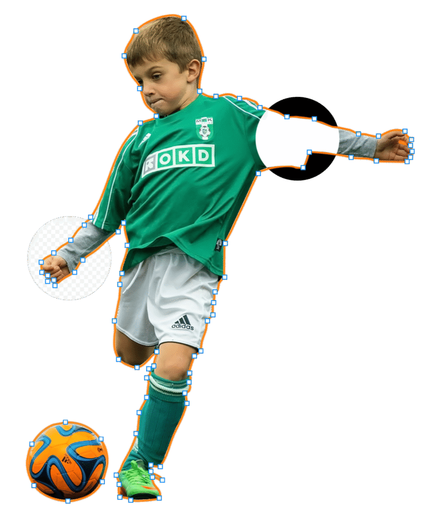 Young boy in a green soccer jersey kicking an orange and blue soccer ball during a game.