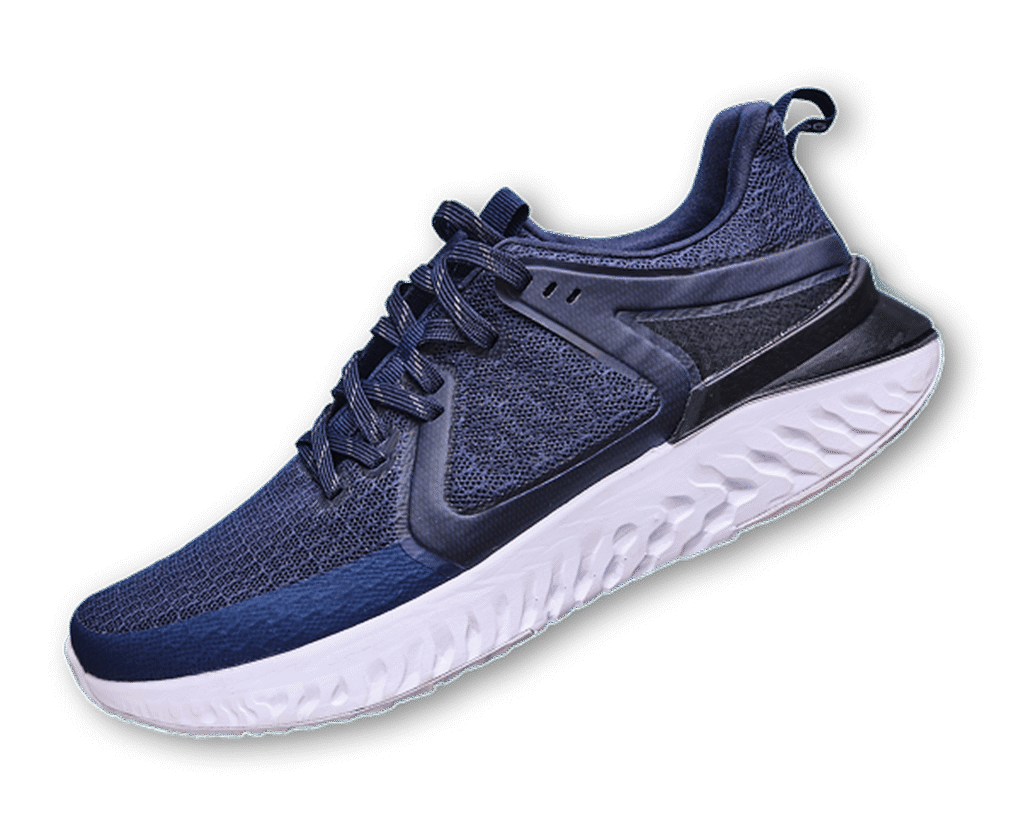 Elegant gold strappy high heel sandals on an orange background.