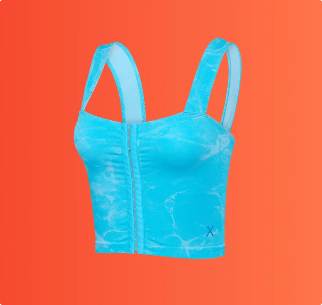 Blue marble-pattern sleeveless crop top with front closure displayed on an orange background