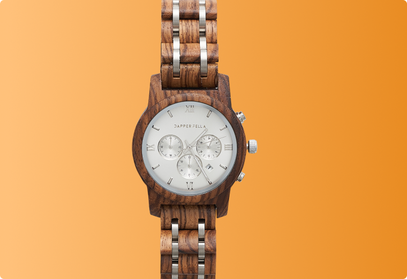 Wooden wristwatch with silver dial and chronograph displayed on an orange background